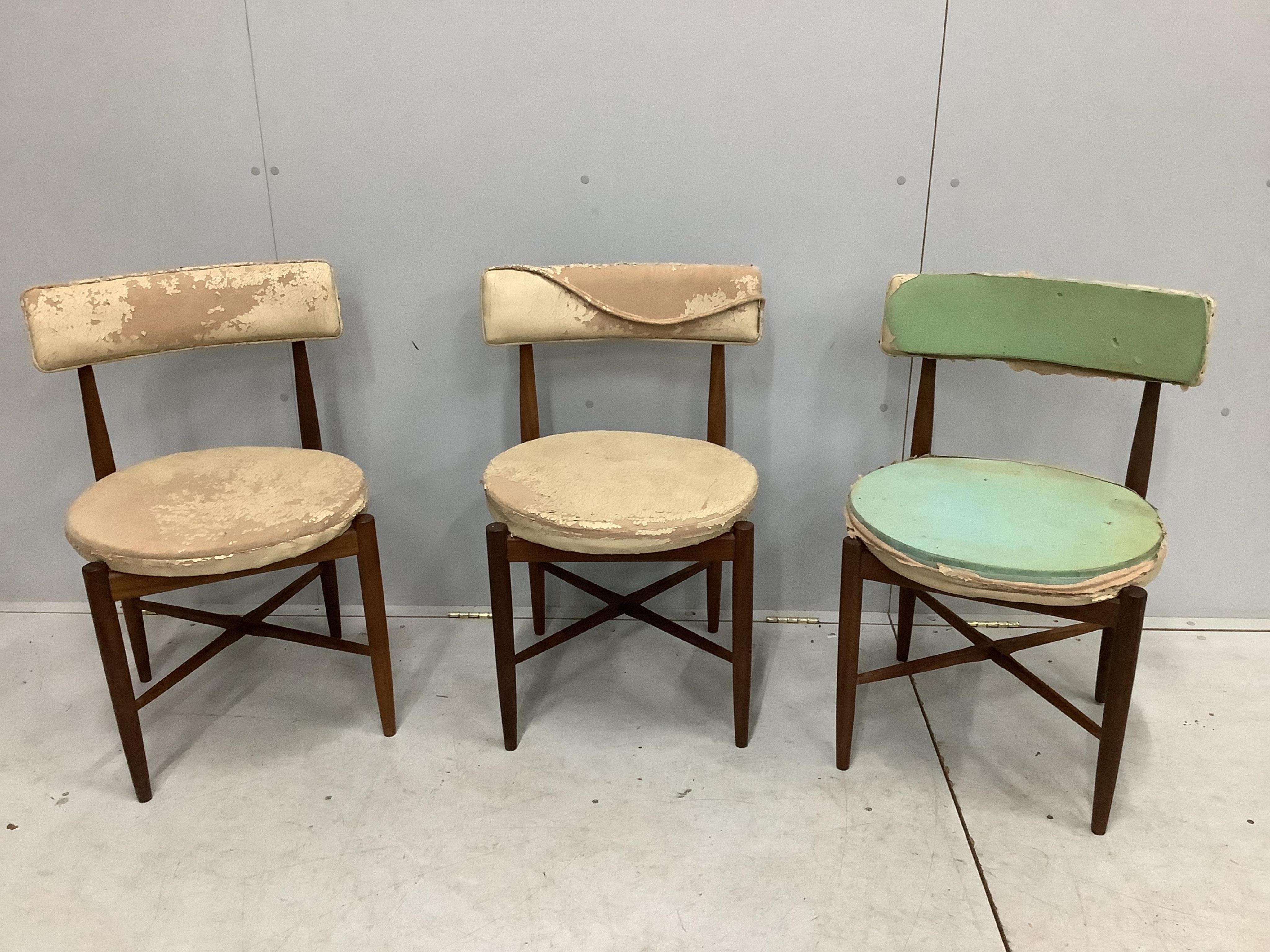 Three G-Plan teak dining chairs with circular seats. Condition - poor